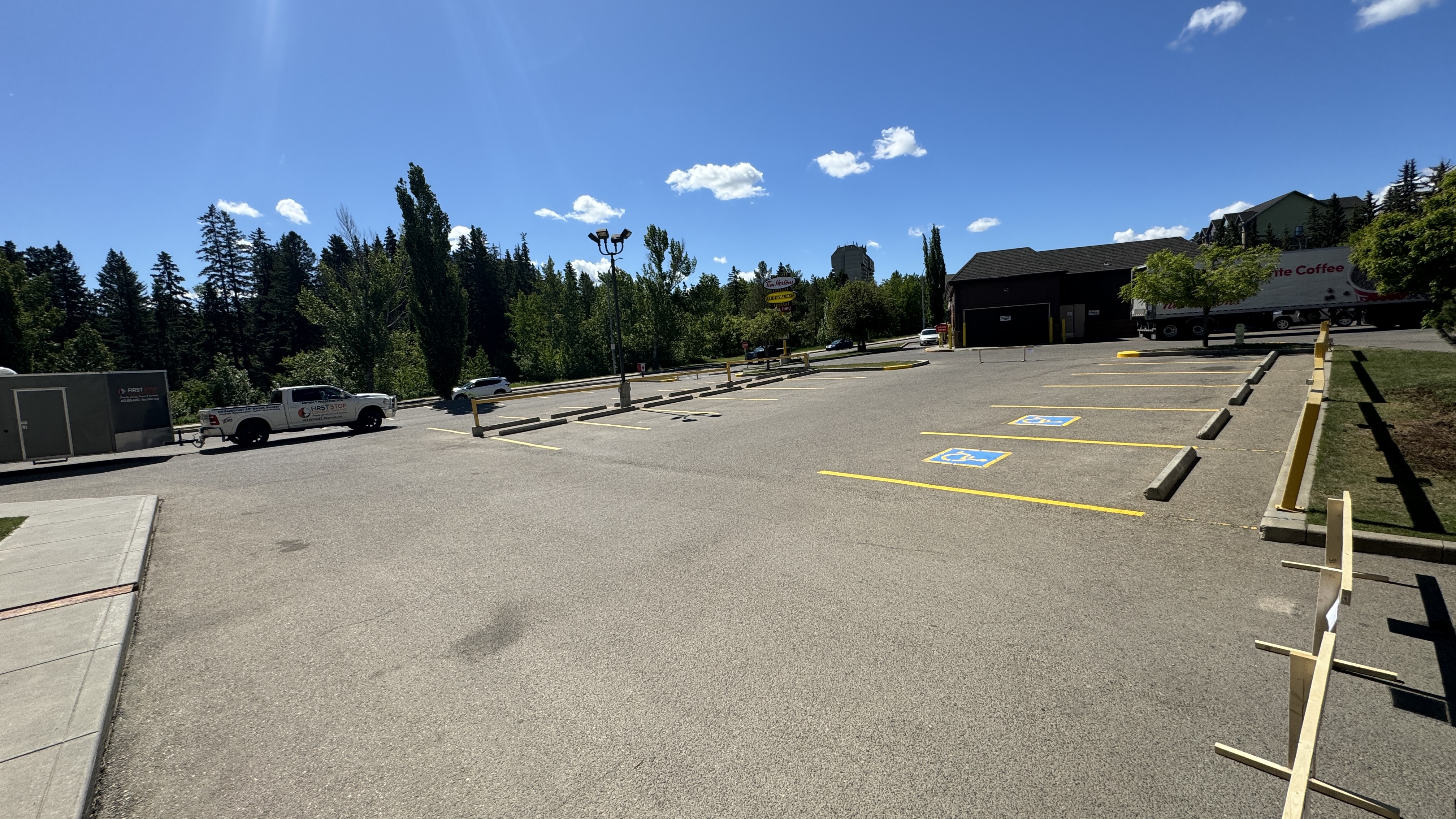 First Stop Contracting truck at completed commercial parking lot — Red Deer, AB