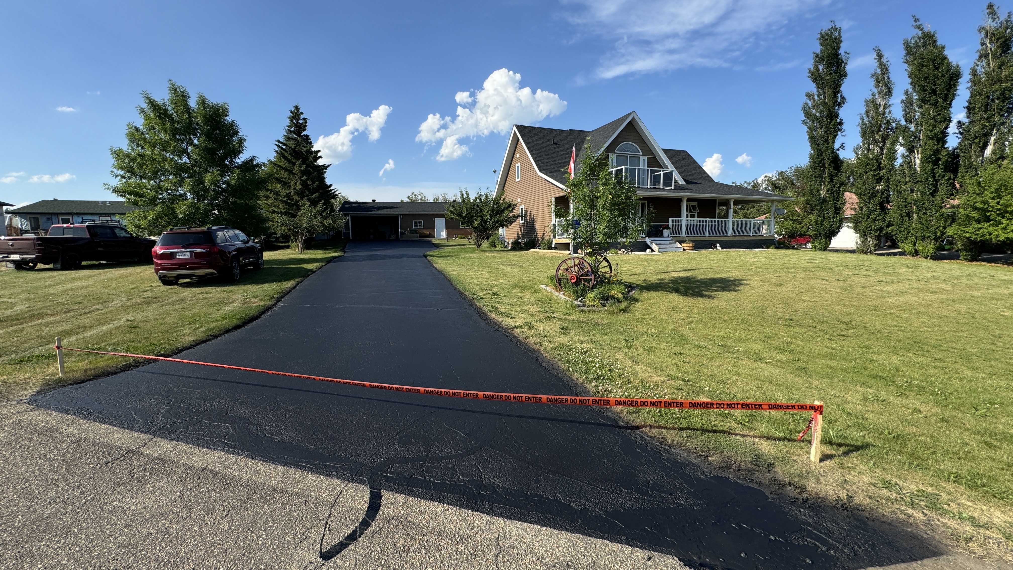 Freshly sealed residential driveway near Gull Lake, Central Alberta